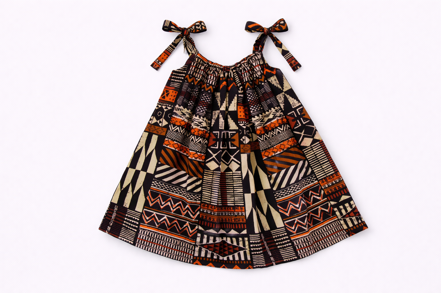 Children's dress with tribal pattern on a white background