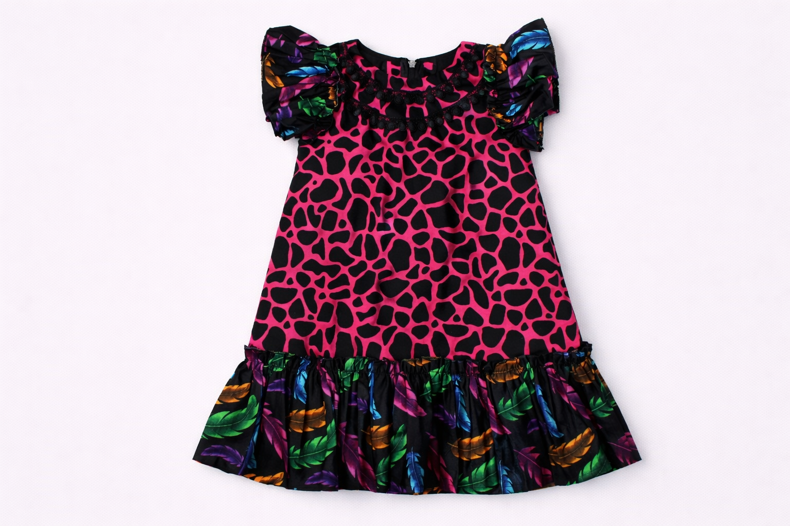 Colorful dress with a pink and black pattern on a white background