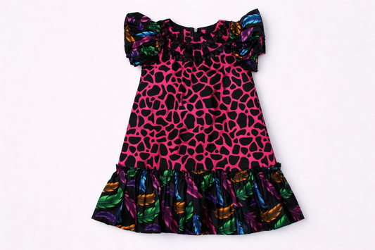 Colorful dress with a pink and black pattern on a white background